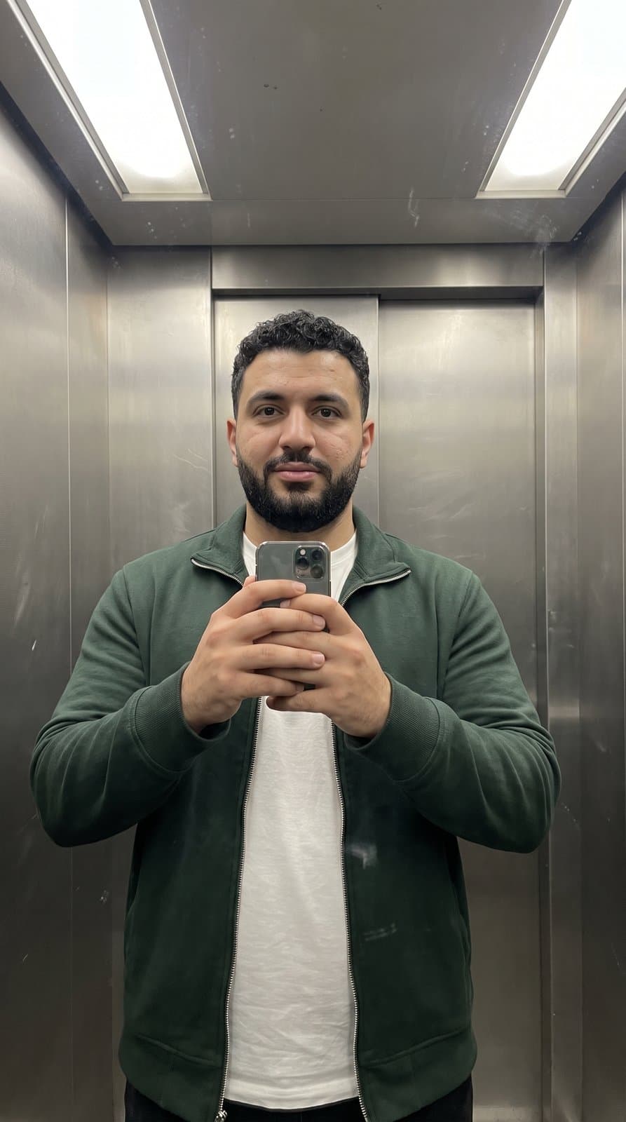 Invented person: AI-generated example input, elevator mirror selfie
