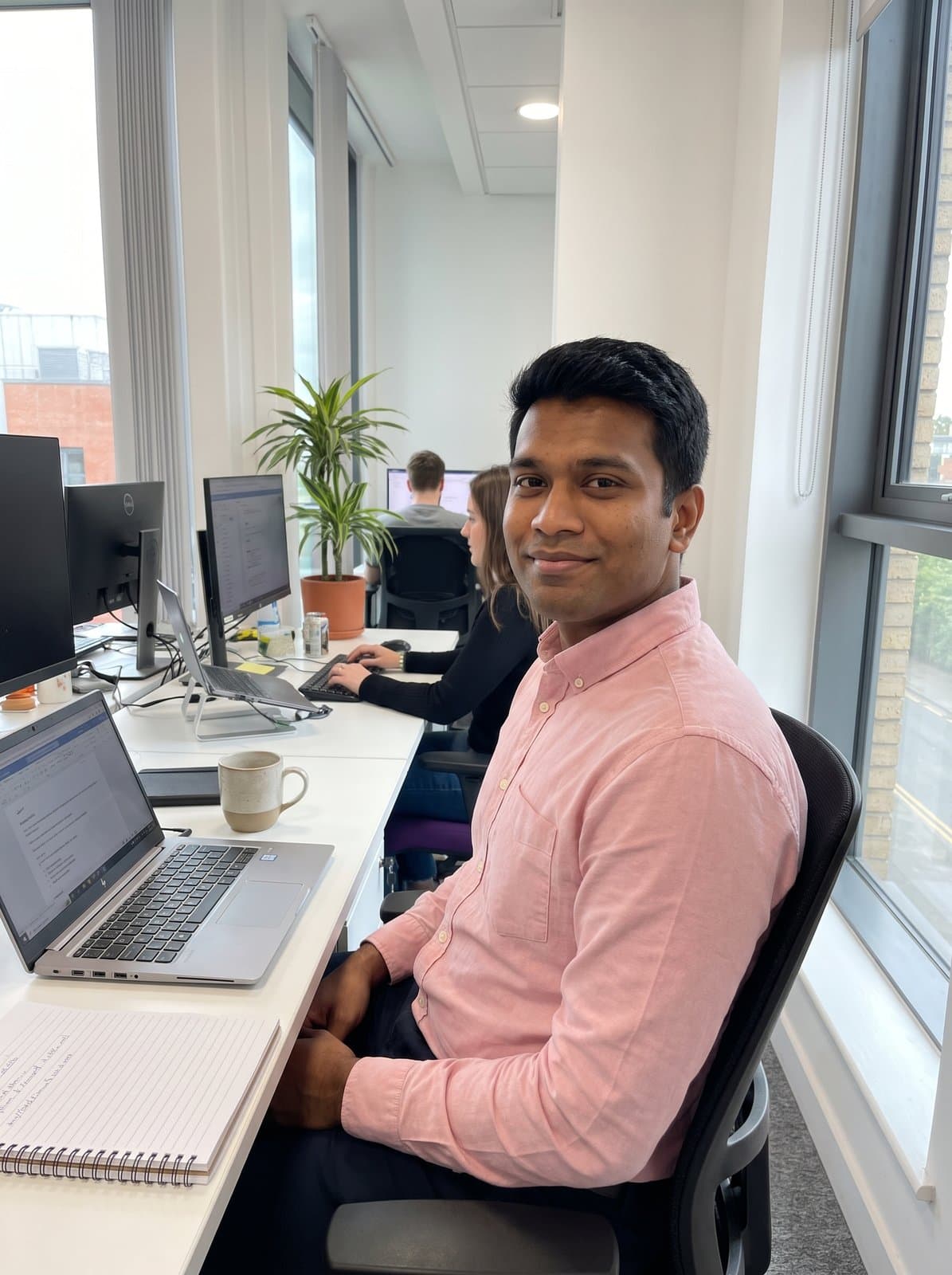 Invented person: AI-generated photo, office by a window